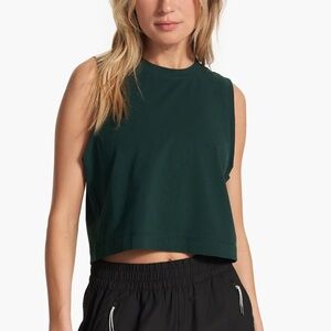 vuori feather crop tank in grass green